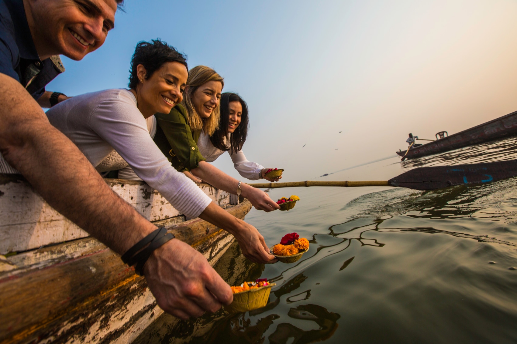 Varanasi Ganges Travellers wish with candle cups full of flowers in Varanasi