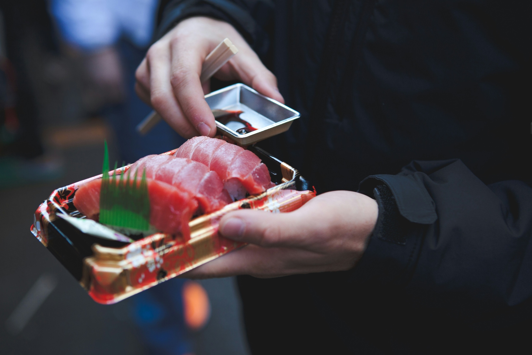 Sushi takeout a traveller gets ready to eat fresh sushi takeout from Tsukiji fish market