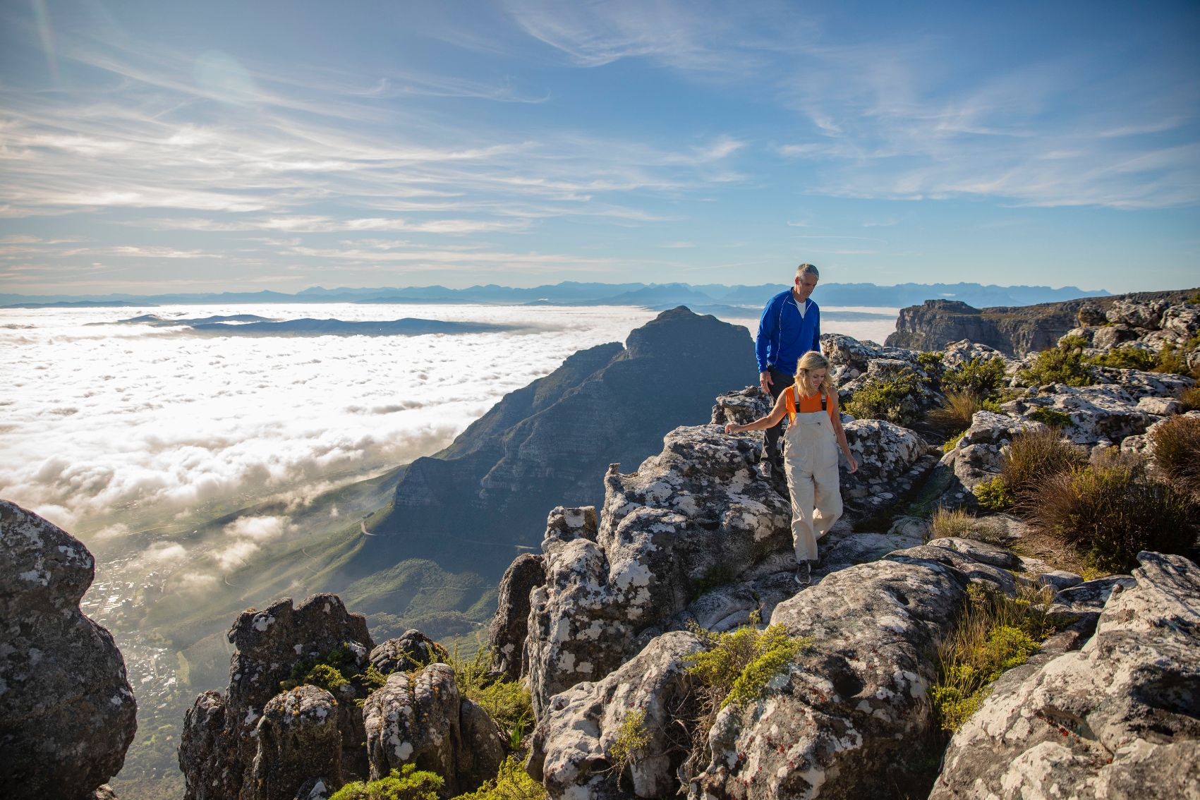 climbing table mountain Couple hiking above the clouds on Table Mountain